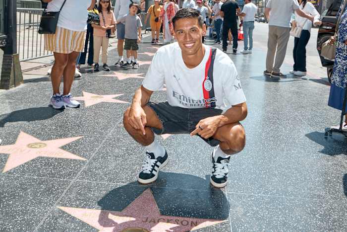 Tijjani Reijnders poses on the Hollywood Walk of Fame.